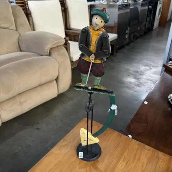 the swinging golfer