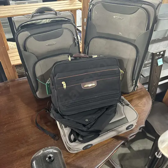 4 suitcases and bag