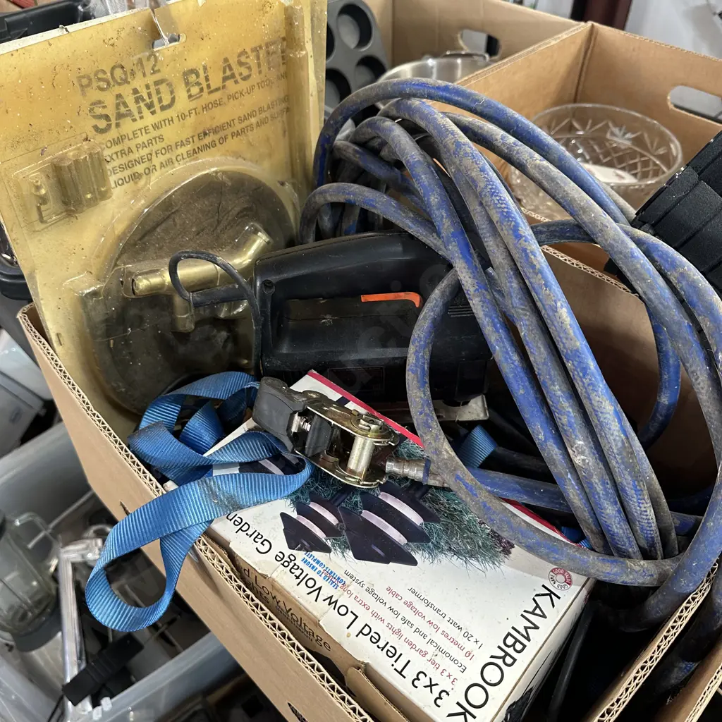 Box lot with sand blaster, jig saw, tie downs and garden lights etc. Image 1++