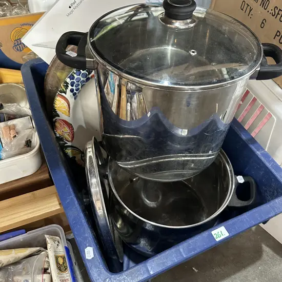Bin full of lidded stock pots, servers etc.