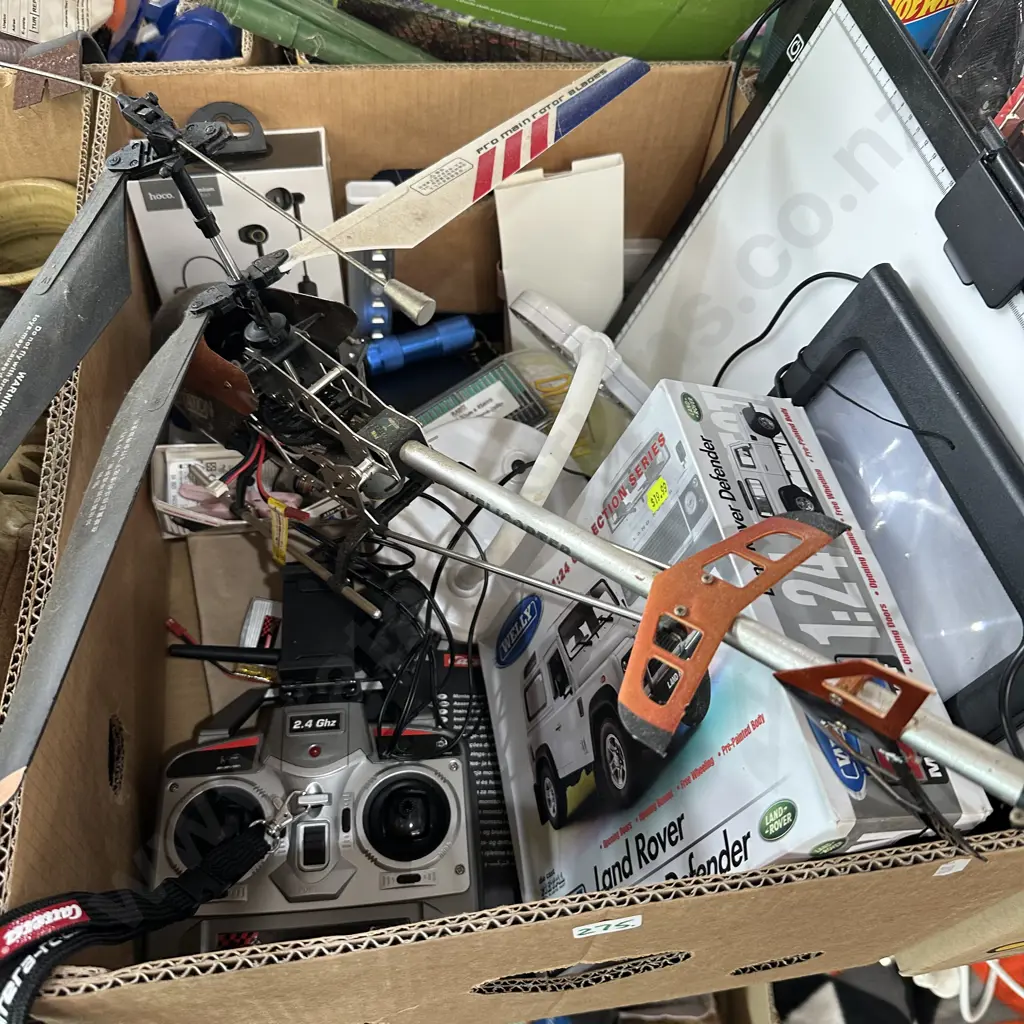 Box lot remote controlled helicopter, new wireless headphones and Land Rover Model etc. Image 1++