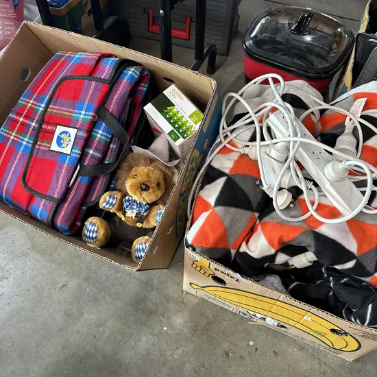 Two boxes picnic rug, blankets, soft toy and extension leads etc.