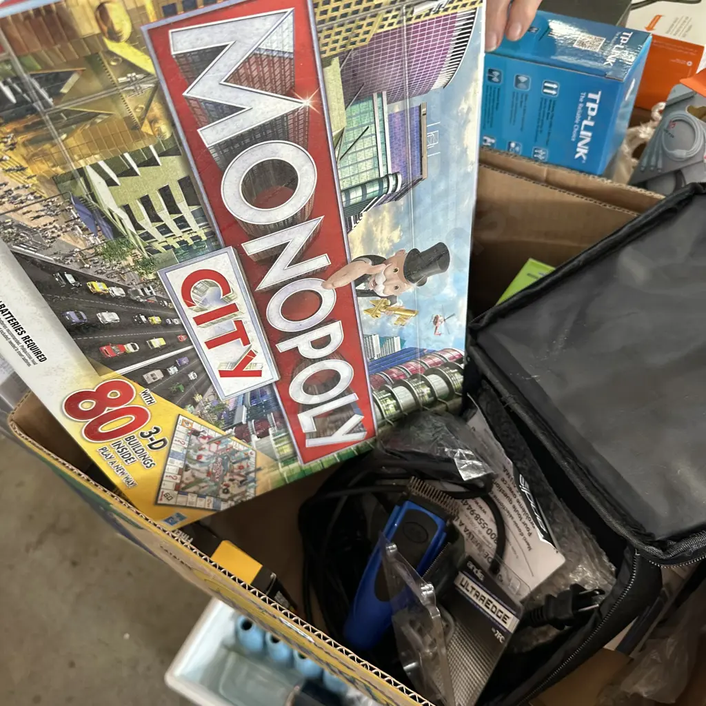 Box lot with Monopoly game and new dog clipper set etc. Image 1++