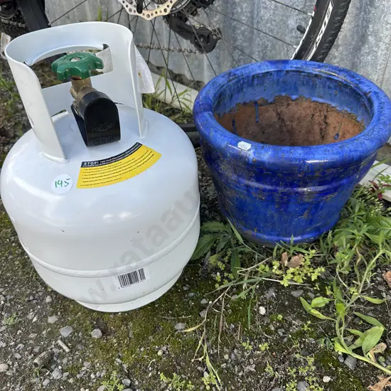 new small empty gas bottle and planter
