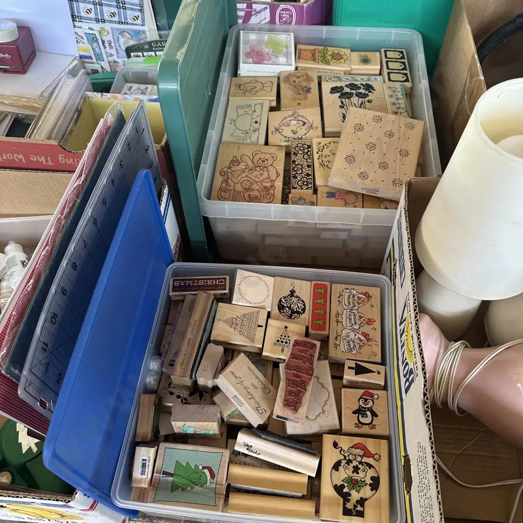 2 lidded containers of rubber stamps Image 1++