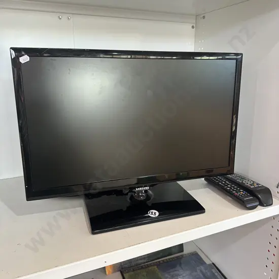 small TV and 2 remotes (no power cord)