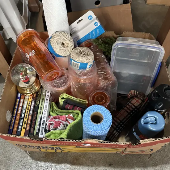 Box of Sistema, new string and Chux cloth, fly spray, umbrella etc.
