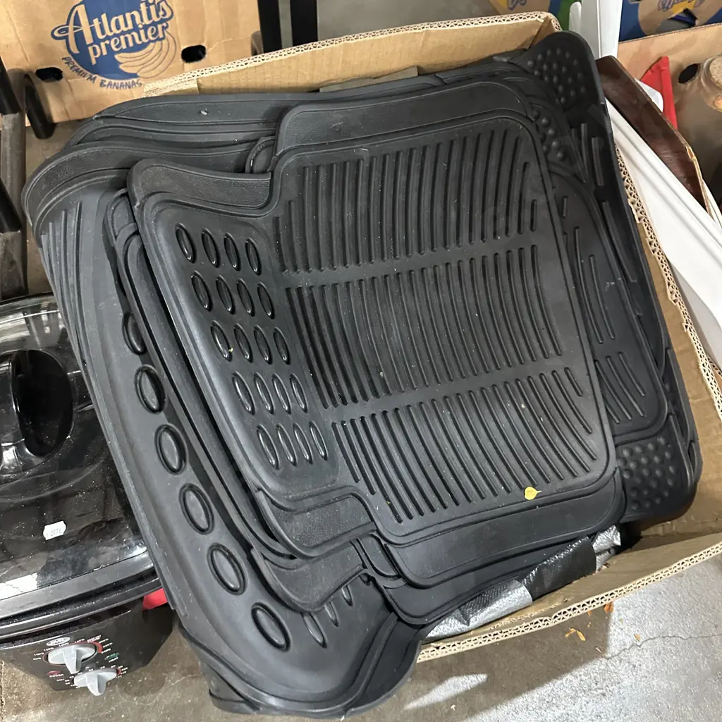 Large tarp and rubber car mats. Image 1++