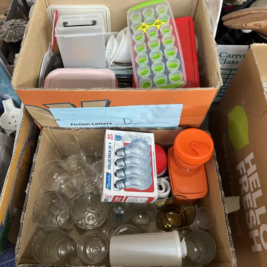 Two boxes kitchenware and spare light bulbs etc.