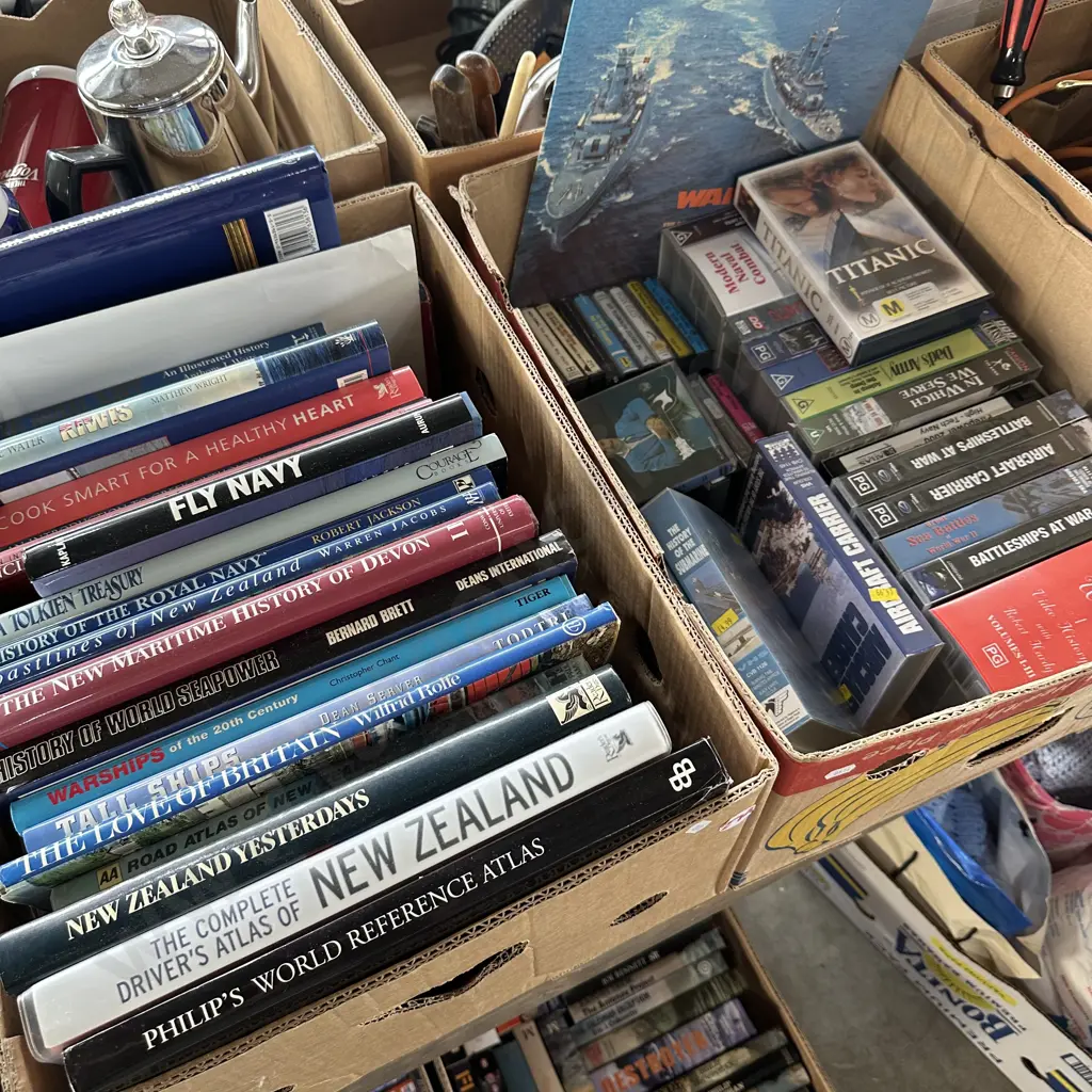Two boxes of books ,videos and cassettes. Image 1++