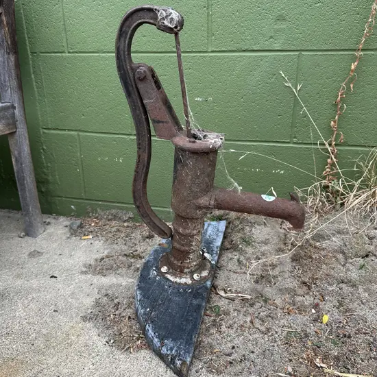 antique cow tail water pump