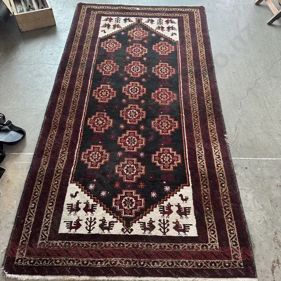 Persian rug 2200 x 1100 (slight damage to edge)