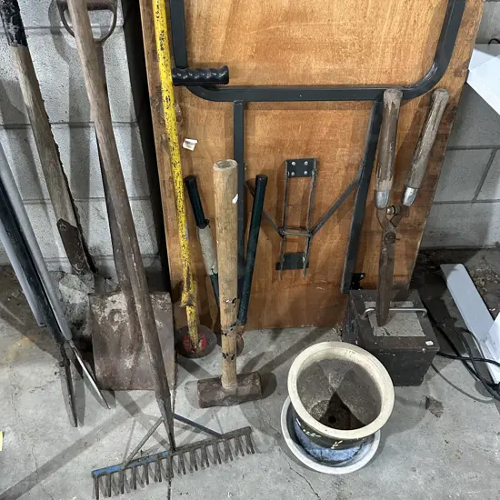 Large lot of garden tools, sledge hammer, planter and transformer.