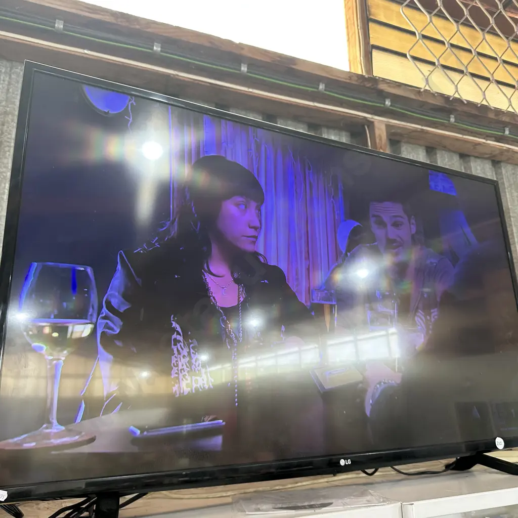 Large LG TV with remote- working Image 1++