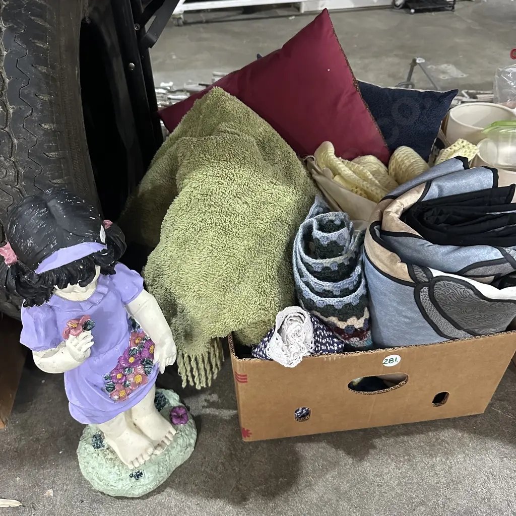 Box of blankets and cushions plus statue. Image 1++