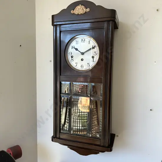 Cased wall clock with key