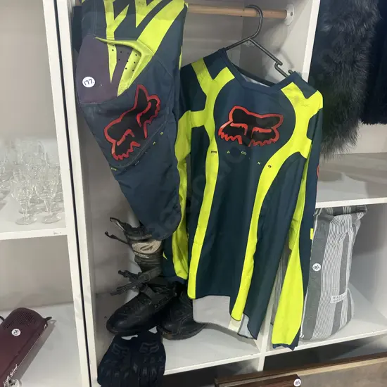 Motorcross boots, gloves, pants and top.