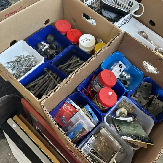 Two boxes of hardware including galvanised bolts and coach screws etc.