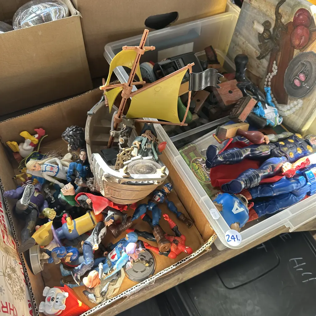 Two boxes of toy figures and vintage rubber stamps. Image 1++