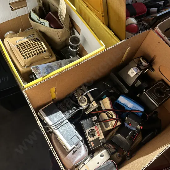 Two boxes of collectable cameras.