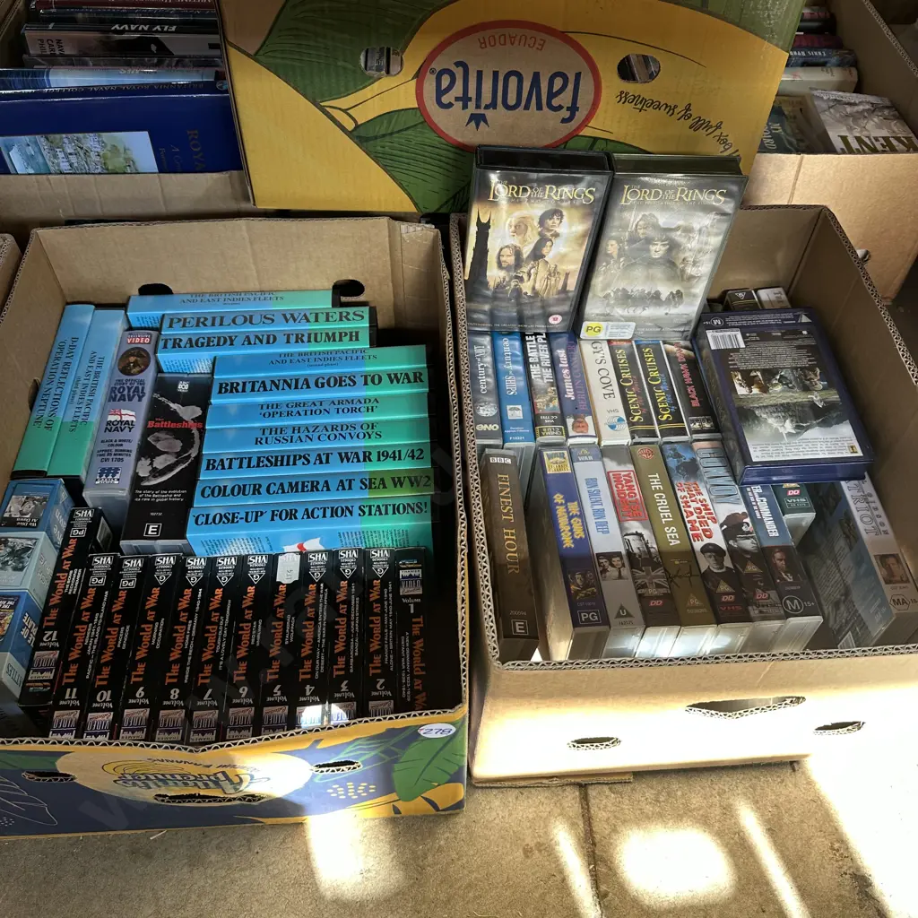 Two boxes of war videos and Lord of the rings plus others. Image 1++