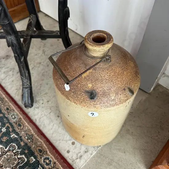 stone jar with metal handle