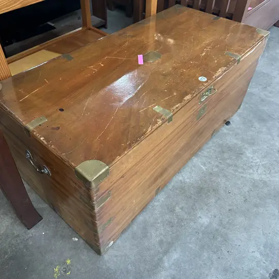 wooden trunk , brass inlays