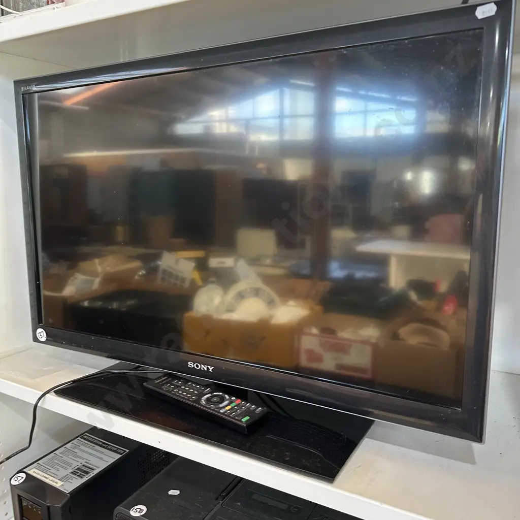 Sony TV and remote Image 1++