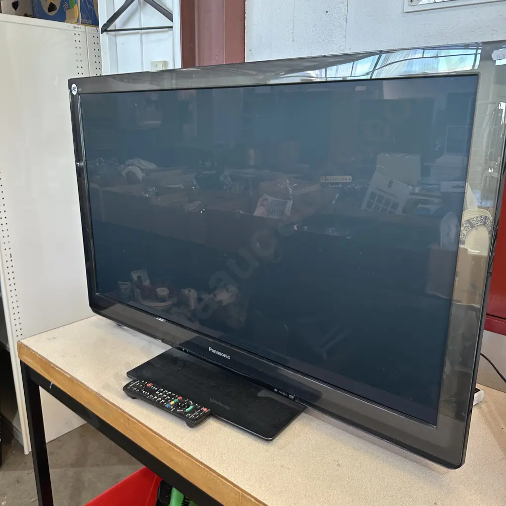 large Panasonioc TV and remote Image 1++