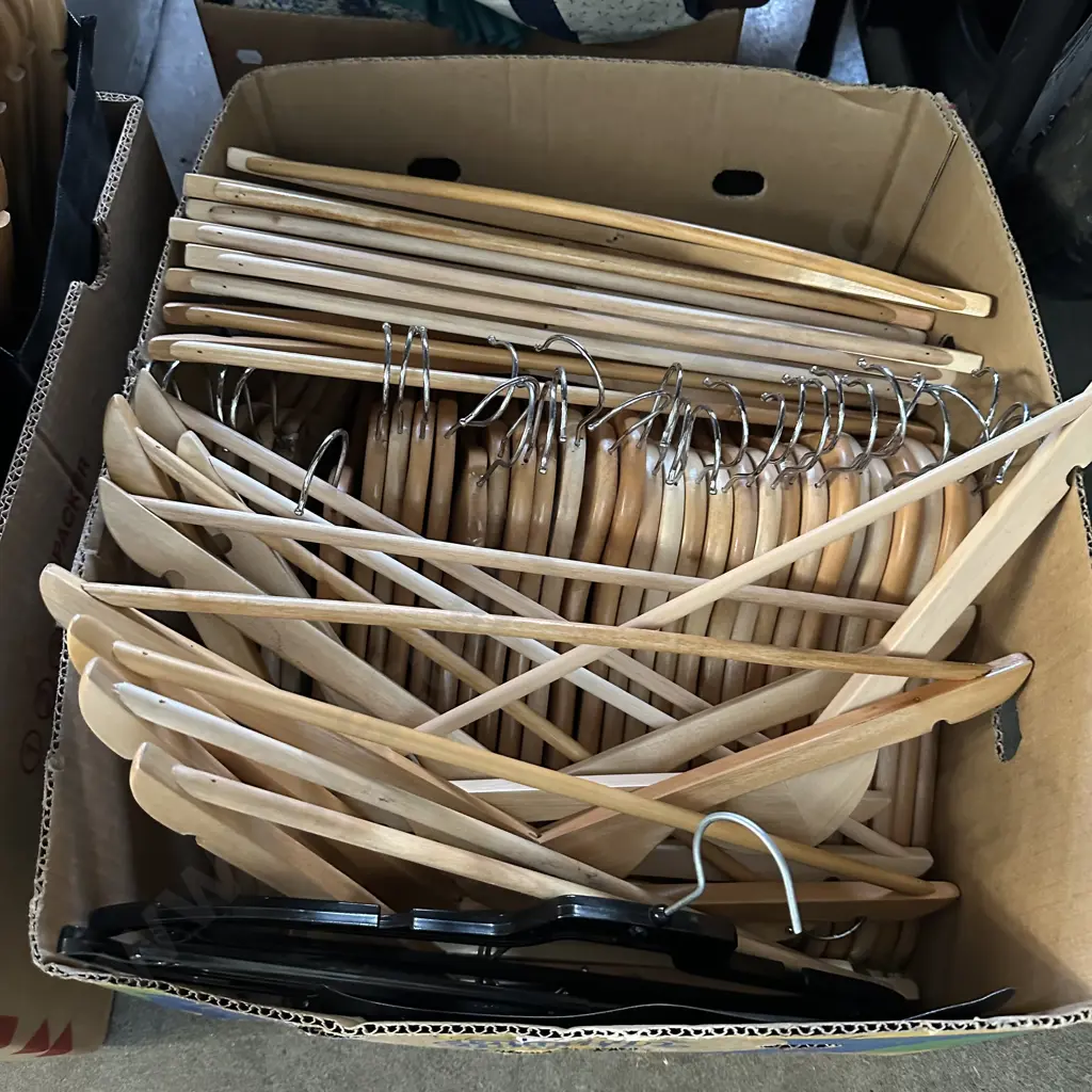 Box of wooden coat hangers. Image 1++