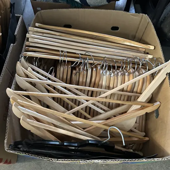 Box of wooden coat hangers.