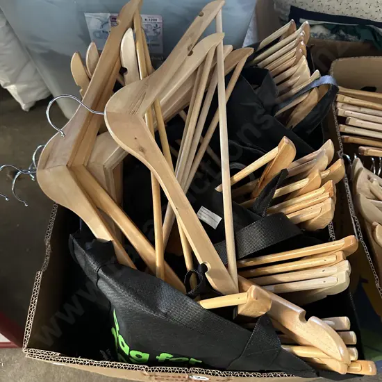 Box of wooden coat hangers.