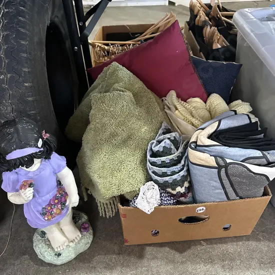 Assorted blankets, cushions plus statue
