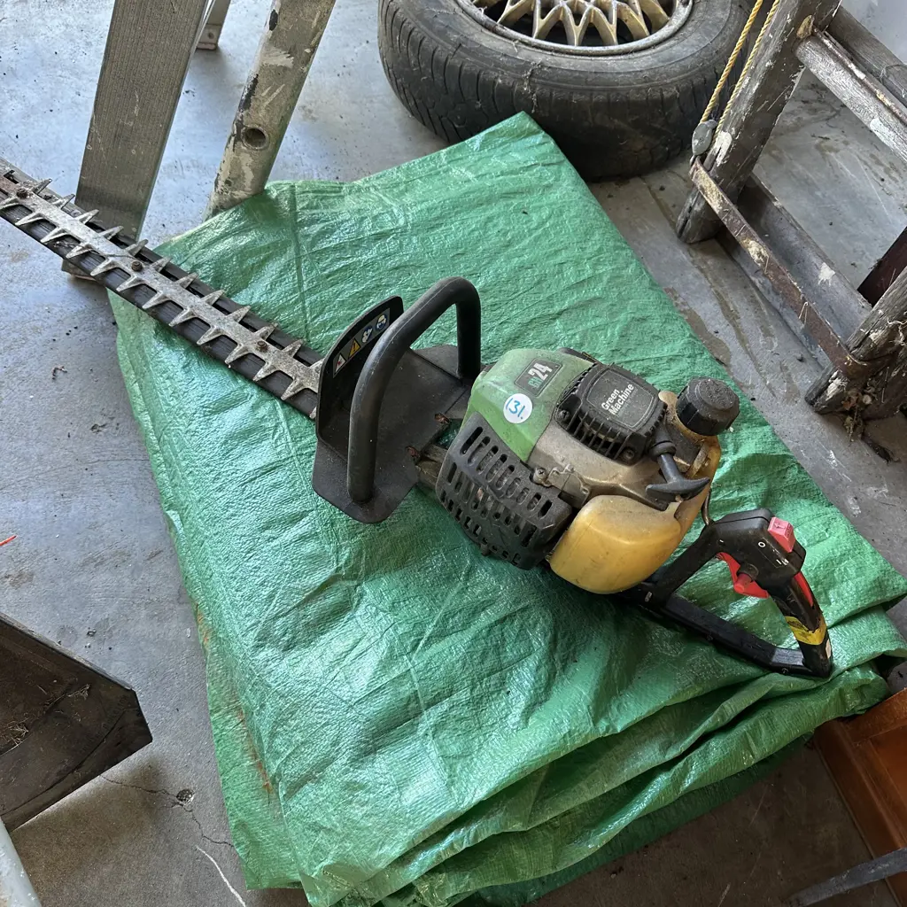 petrol trimmer and tarp Image 1++