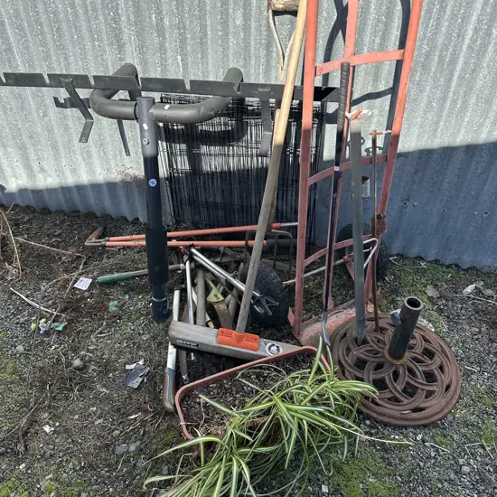 Large lot garden tools, sack barrow, umbrella stand, bike and wall rack, spider plant etc.