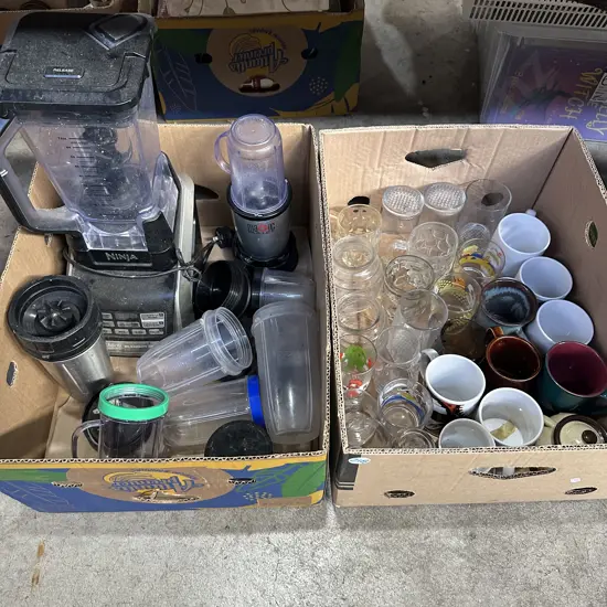 Two boxes Ninja blender, magic bullet etc.