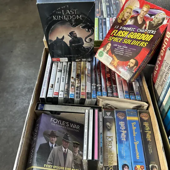 Box of DVDs including Flash gordon plus videos and CDs.