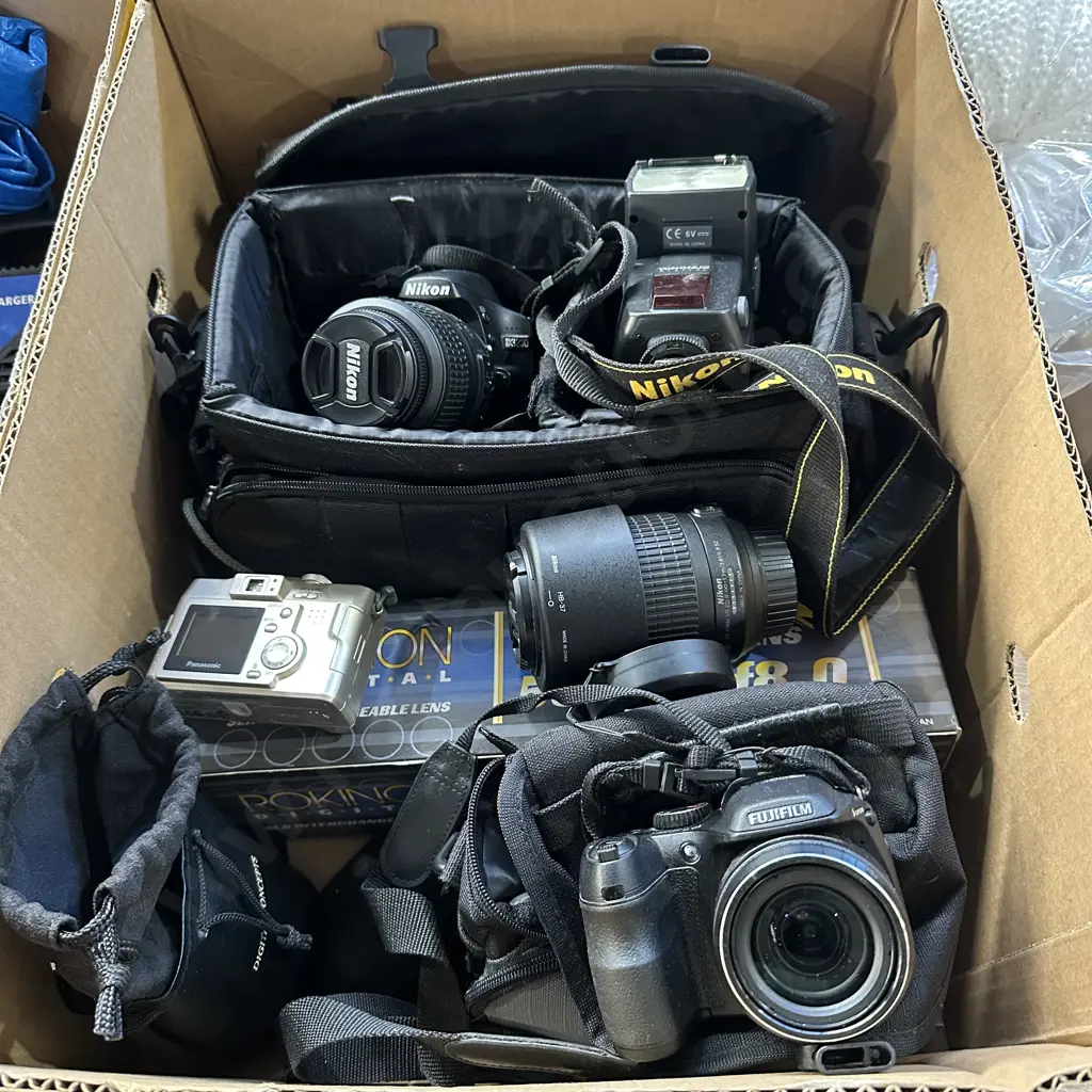 Box of cameras and lenses. Image 1++