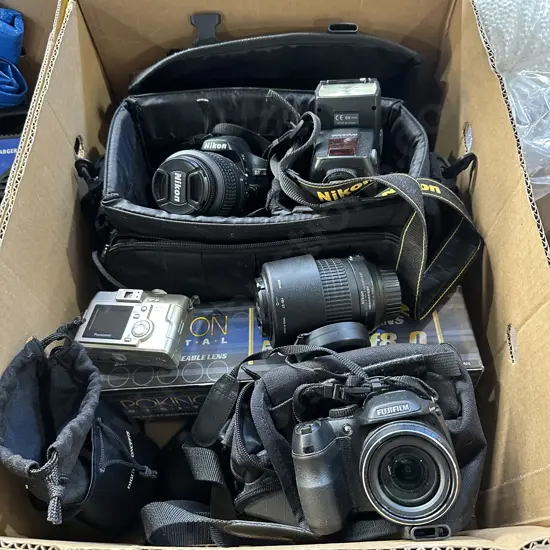 Box of cameras and lenses.