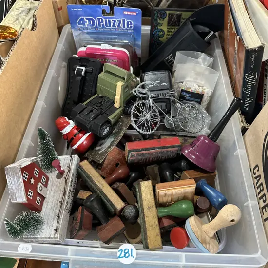 Bin of rubber stamps, toys and craft sea shells etc.