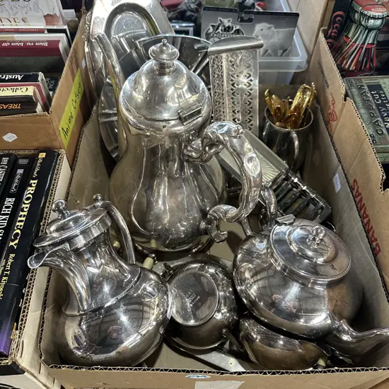 Box of silverware and gold cutlery.