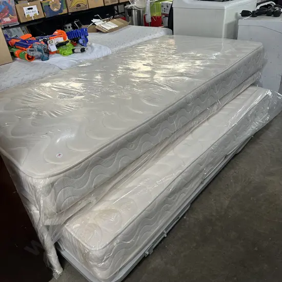 very tidy King single bed with pull out trundle mattress