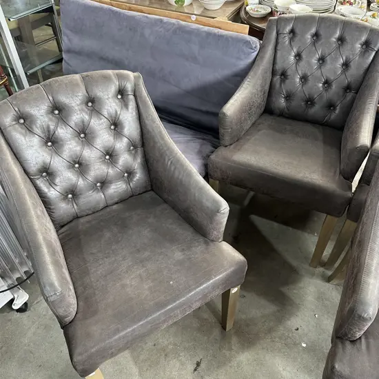 Pr of distressed leather button back chairs
