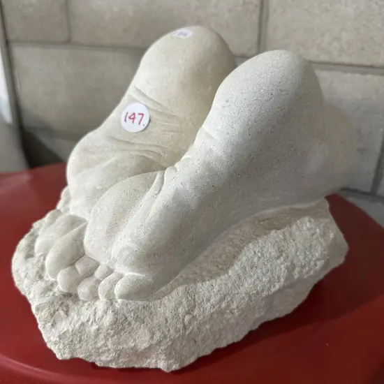 carved stone feet