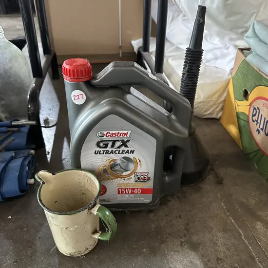 Part container of Castrol oil plus enamel jug and funnel.