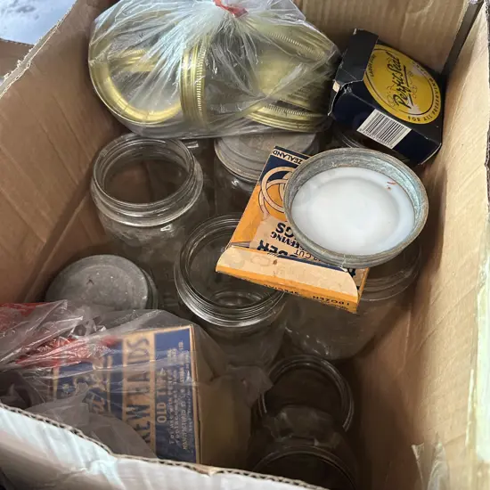 Sixteen large and two small Agee jars plus some seals and lids.