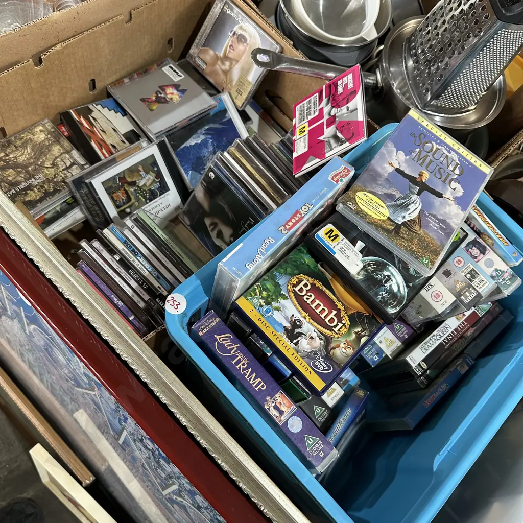 Box and bin of good CDs, DVDs and Video cassettes. Image 1++