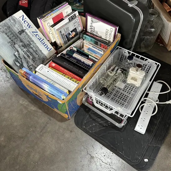 Box of books plus rubber car mats, aftershave etc.