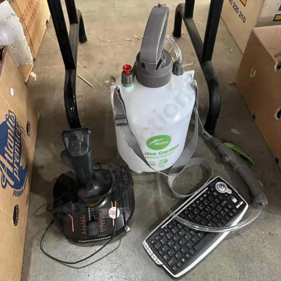 Thrustmaster, keyboard and five litre sprayer.
