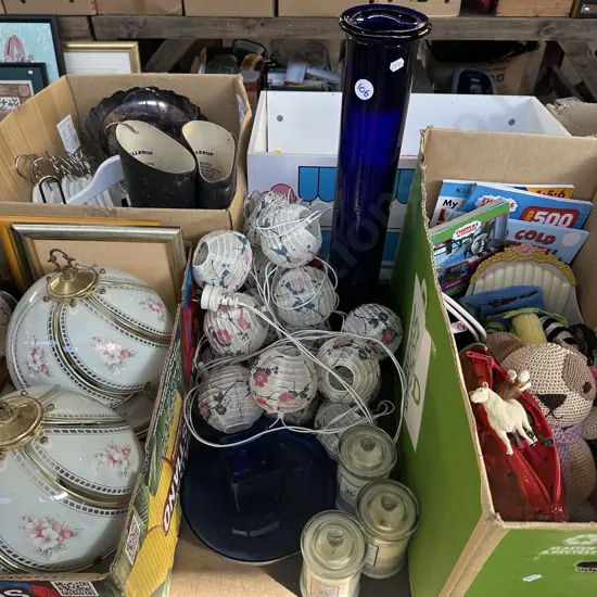 String of lantern lights, candles, tall blue glass vase etc.